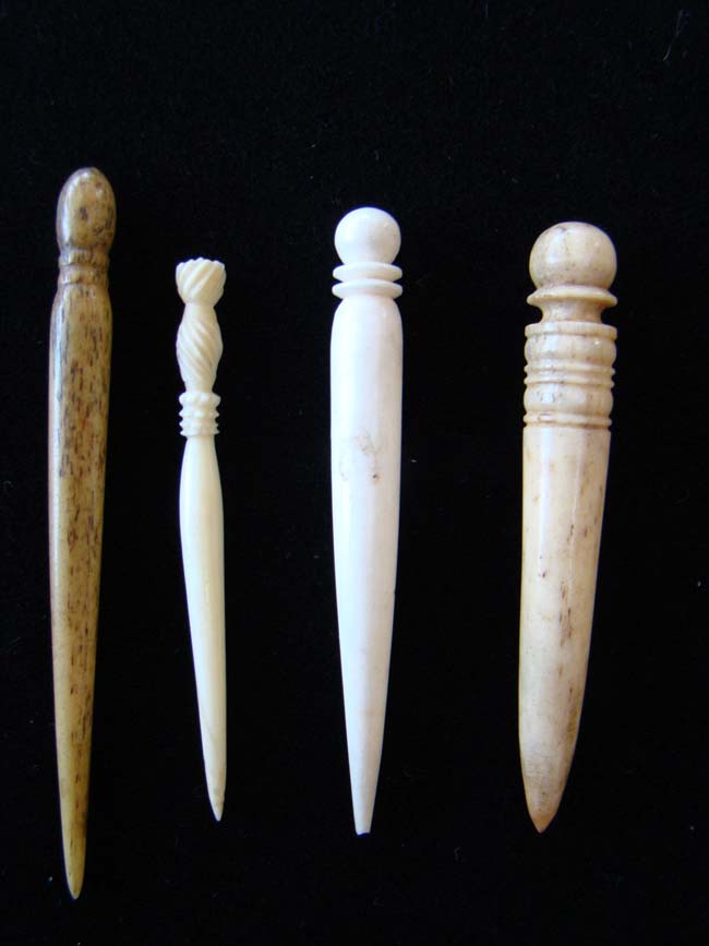 A group of three 19th century sailor carved whalebone and whale ivory bodkins